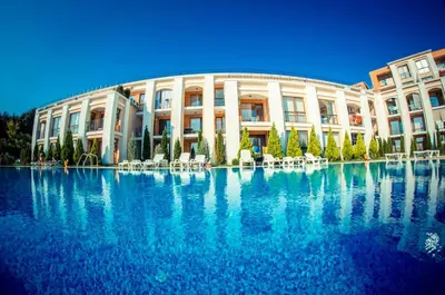 a large swimming pool in front of a building at Sea Fort Club & Grand Resort in Sveti Vlas