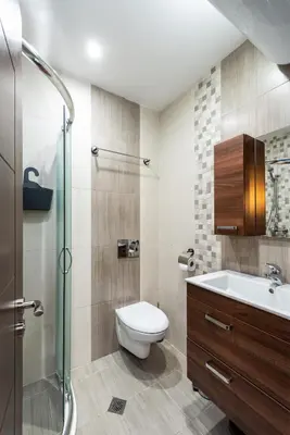 a bathroom with a toilet and a sink and a shower at МЯСТОТО in Burgas City