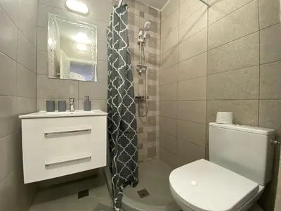 a bathroom with a toilet and a sink and a shower at ANITA B16 Studio Sunny Beach in Sunny Beach