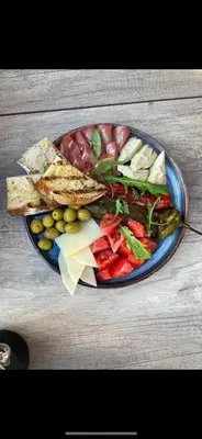 a plate of food with different foods on a table at Amara Sugar Hotel in Sunny Beach