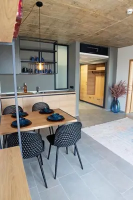a dining room with a wooden table and chairs at Amara Sugar Hotel in Sunny Beach