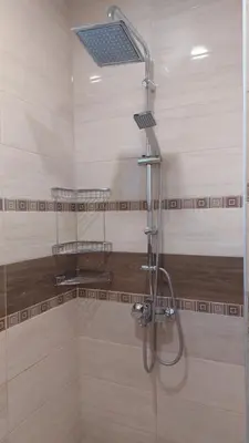 a shower with a glass door in a bathroom at Апартамент Pink & Blue - 2BDR with Balcony - Wi-Fi in Varna City
