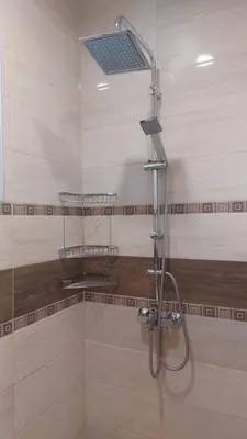 a shower with a shower head in a bathroom at Апартамент Pink & Blue - 2BDR with Balcony - Wi-Fi in Varna City