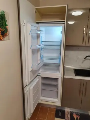 an empty refrigerator with its door open in a kitchen at Апартамент За Гости ,,1В-15