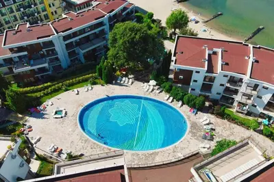 an overhead view of a large swimming pool with a beach at Messambria Fort Beach - Premium Apartments in Elenite
