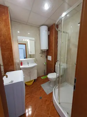 a bathroom with a shower and a toilet and a sink at Holiday Fort Golf Club - Premium Apartments in Sunny Beach