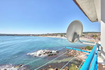 a view of the beach from a balcony at 1BD Flat with a stunning SEA VIEW in Sozopol by Flаt Manаger in Sozopol