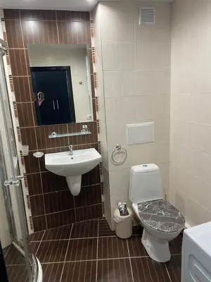a bathroom with a sink and a toilet and a mirror at Day Dream in Burgas City