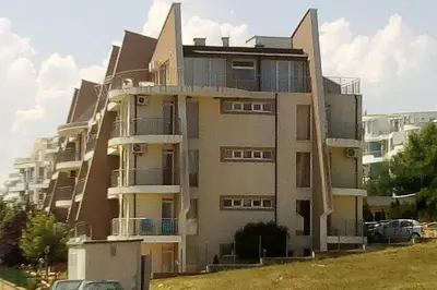 a tall building with balconies on the side of it at Апартамент в Комплексе Сансет Кошарица,Солнечный берег in Kosharitsa