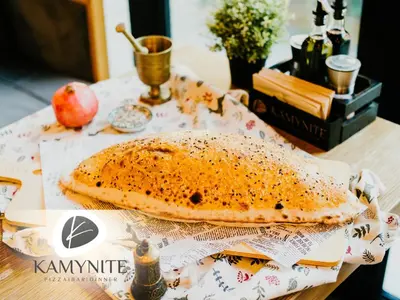 a pita bread sitting on top of a table at Хотел Камъните in Burgas City