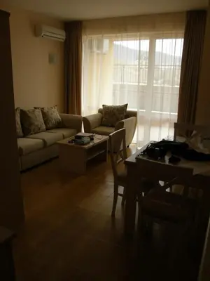 a living room with a couch and a table at Magic Dreams Apart Complex Studio Sveti Vlas in Sveti Vlas