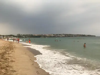 a group of people in the water at the beach at Santa Marina 2-bedroom apt. w/ Sea View + Terrace in Sozopol