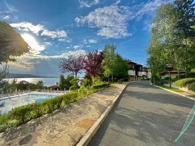 a road in a resort with a swimming pool at Santa Marina 2-bedroom apt. w/ Sea View + Terrace in Sozopol