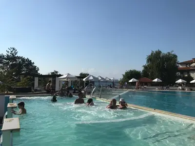 a group of people swimming in a swimming pool at Santa Marina 2-bedroom apt. w/ Sea View + Terrace in Sozopol
