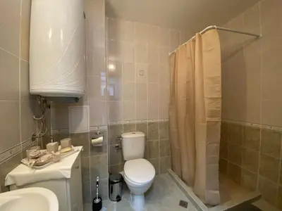 a bathroom with a toilet and a sink and a shower at ANITA A15 Family Apartment Sunny Beach in Sunny Beach