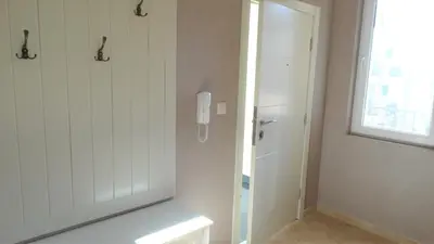 a bathroom with a shower and a phone on the wall at Captain's Island Deluxe in Chernomorets