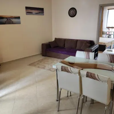 a living room with a couch and a table and chairs at Kalia, Zweizimmer, Zweibalkon, Top-Apartment in Sunny Beach