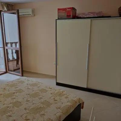 a room with a bed and a large refrigerator at Kalia, Zweizimmer, Zweibalkon, Top-Apartment in Sunny Beach