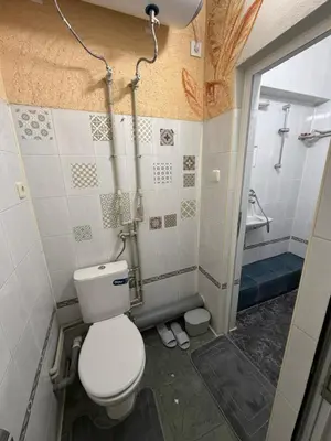 a bathroom with a toilet and a shower at Nõma studio in Varna City