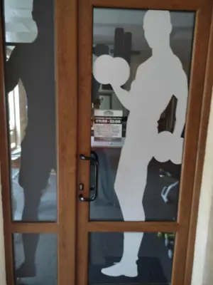 a door with a reflection of a person on it at Prestige Fort Beach Private Apartment-Studio 46 in Sveti Vlas