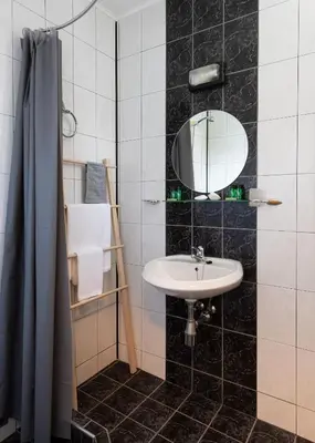 a bathroom with a sink and a mirror at Sea House Afrodita II in Nesebar