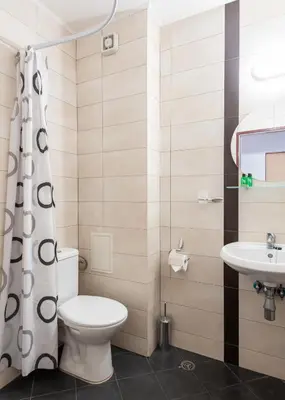 a bathroom with a toilet and a sink at Sea House Afrodita II in Nesebar