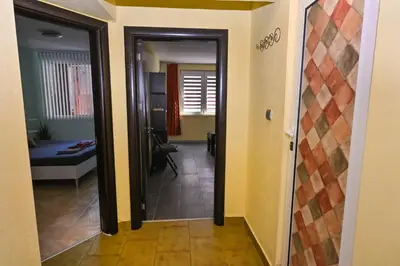 a hallway with a door leading to a living room at Eli Apartment Burgas Center in Burgas City