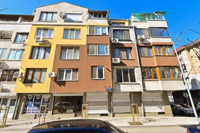 a tall building on the side of a street at Eli Apartment Burgas Center in Burgas City