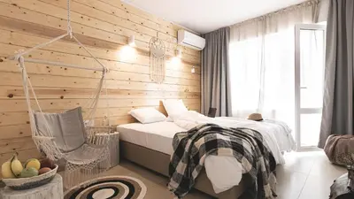 a bedroom with a swinging bed and a basket of fruit at La Finca - Saint Vlas in Sveti Vlas