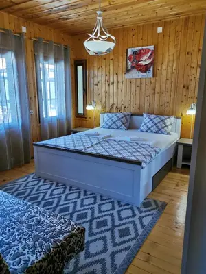 a bedroom with a large bed in a room at The Old House in Nesebar