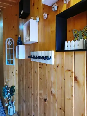 a wall with wooden paneling in a restaurant at The Old House in Nesebar