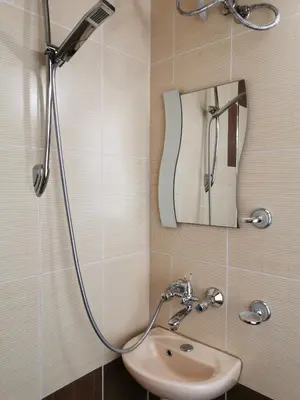 a bathroom with a sink and a shower at The Old House in Nesebar