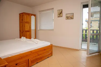 a bedroom with a bed and a large window at Villa Beni - 4 Bedroom Private House by Flаt Manаger in Lozenets