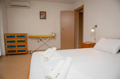 a bedroom with two beds with towels on them at Villa Beni - 4 Bedroom Private House by Flаt Manаger in Lozenets