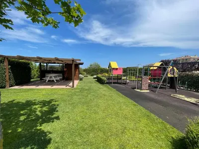 a park with a playground and a picnic shelter at Provence Deluxe Apartment in Atia Resort in Chernomorets