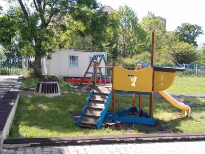 a playground with a slide in a park at The Blue Studio - In a complex next to the beach by Flаt Manаger in Pomorie