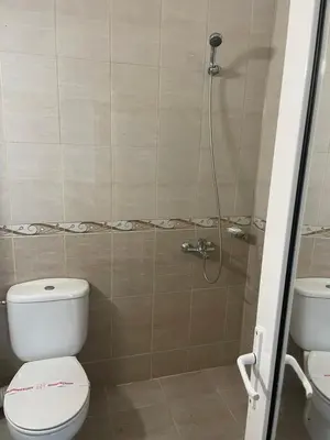 a bathroom with a toilet and a shower at Hotel ECO Palace in Primorsko