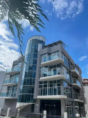 a tall building with a lot of windows at Hotel ECO Palace in Primorsko