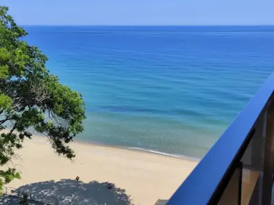 a view of the beach from a balcony at студио Водолей in Obzor