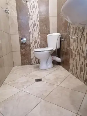 a bathroom with a toilet and a sink at Megi Apartments, Nesebar sity in Nesebar