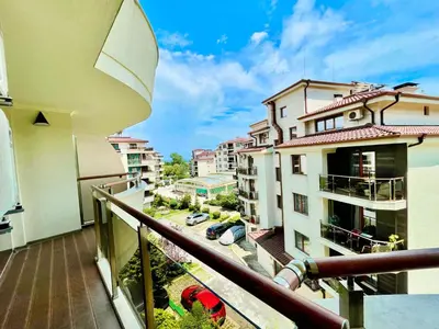 an apartment balcony with a view of a parking lot at Long Sunny Holiday in Shkorpilovtsi