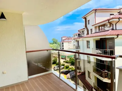 a balcony with a view of a parking lot at Long Sunny Holiday in Shkorpilovtsi