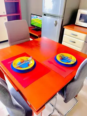 a table with two plates on top of it at Апартамент Морски Изглед in Burgas City