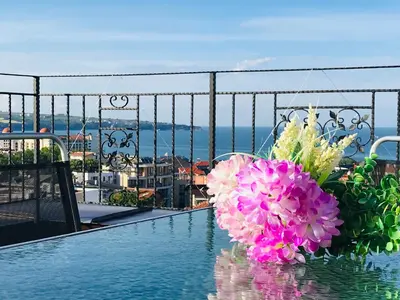 a bouquet of flowers sitting on top of a pool at Panorama beach Obzor in Obzor