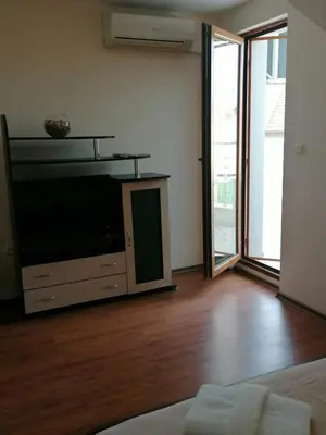 a living room with a large flat screen tv at Villa Mareli in Tsarevo