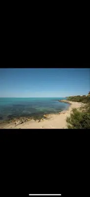a picture of a beach with the ocean at sea ​​view apartment Sozopol in Sozopol