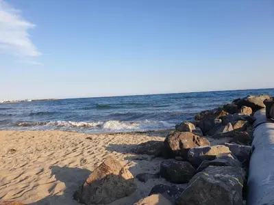a beach with some rocks and the ocean at MitProt luks studio Panorama Bay 2 ap.105 in Sveti Vlas
