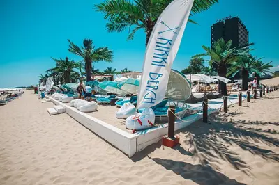 a beach with a sail boat on the sand at Good Vibes apartment Avalon in Sunny Beach
