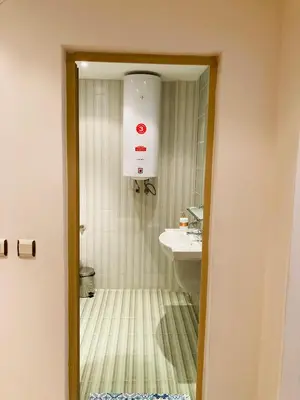 a bathroom with a sink and a mirror at Good Vibes apartment Avalon in Sunny Beach