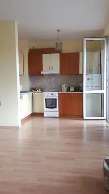 an empty kitchen with a white stove top oven at Sunny Fort Private Apartment in Sunny Beach